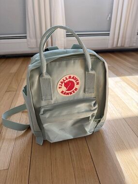 Fjallraven Kanken Mini Backpack in Sage Green with Red Logo